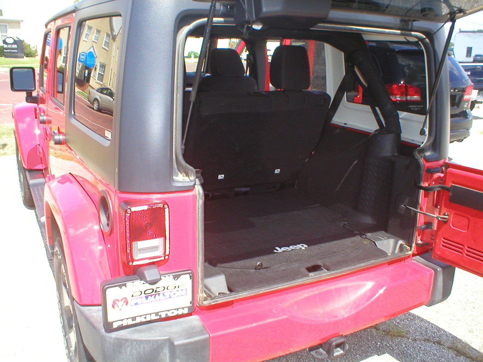 2016 Jeep Wrangler Unlimited Sahara 4X4 4-Door-Firecracker Red - Fred Pilkilton Motors - Denison Texas