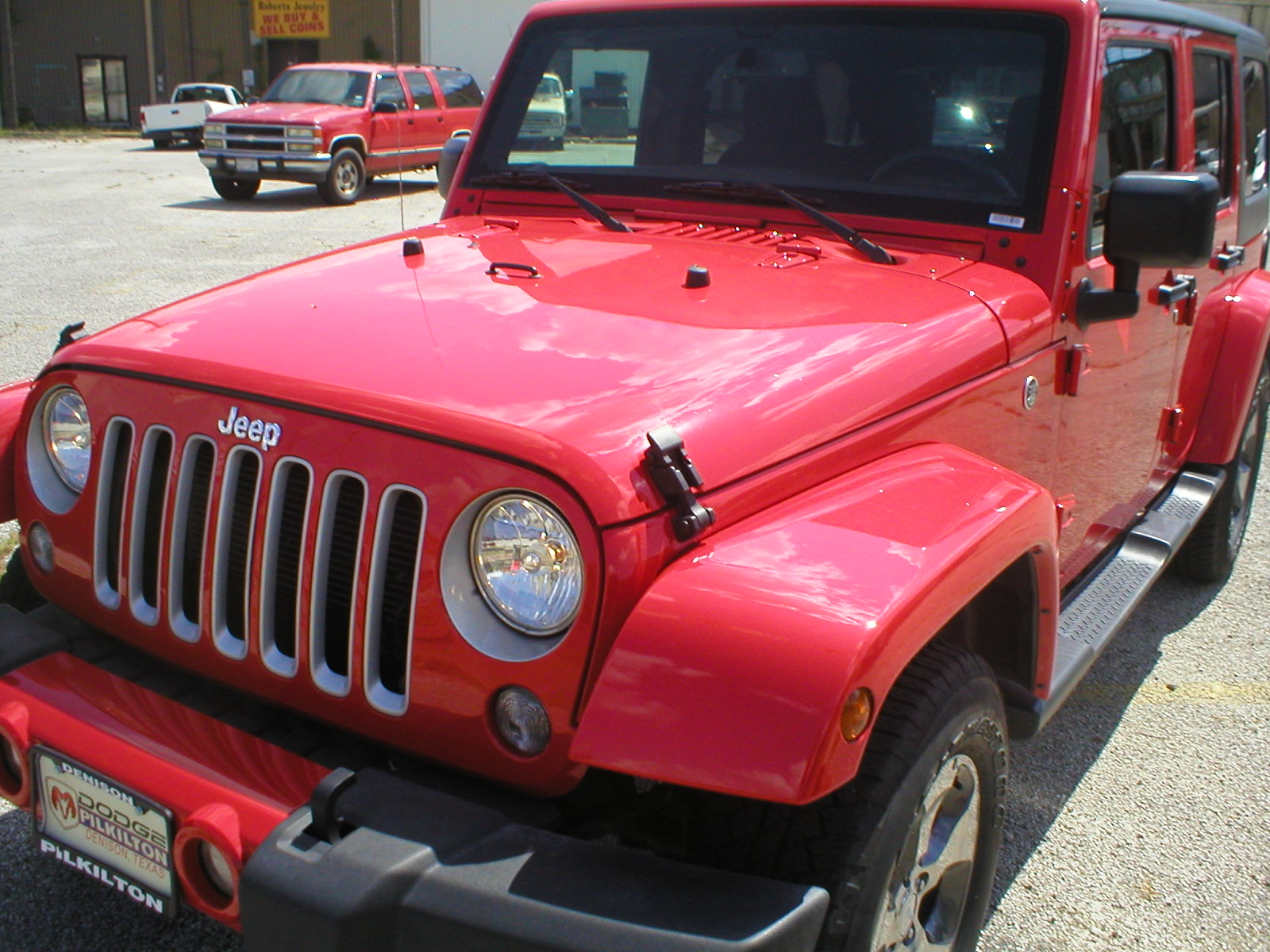 2016 Jeep Wrangler Unlimited Sahara 4X4 4-Door-Firecracker Red - Fred Pilkilton Motors - Denison Texas