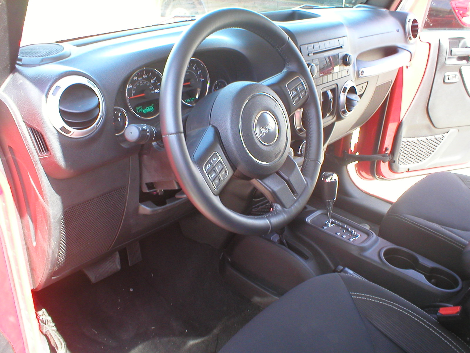 2016 Jeep Wrangler Unlimited Sahara 4X4 4-Door-Firecracker Red - Fred Pilkilton Motors - Denison Texas