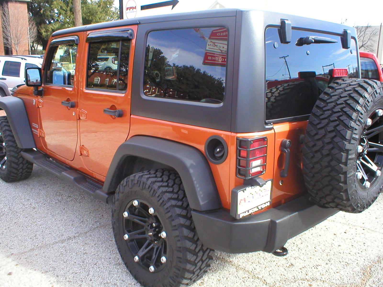 2011 Jeep Wrangler Unlimited Sport S 4-Door 4x4 Copper Pearl - Fred Pilkilton Motors - Denison Texas