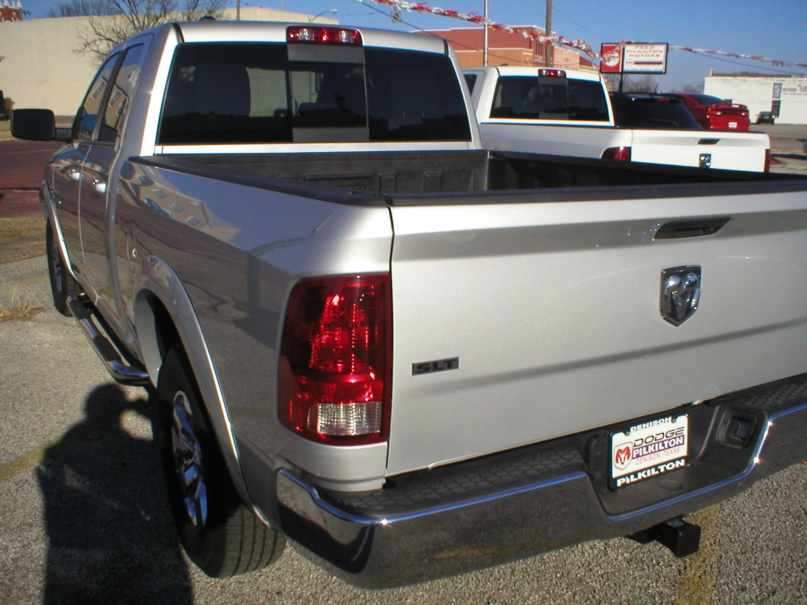 2016 Dodge Ram 1500 SLT Quad Cab 4-Door Pickup Silver - Fred Pilkilton Motors - Denison Texas