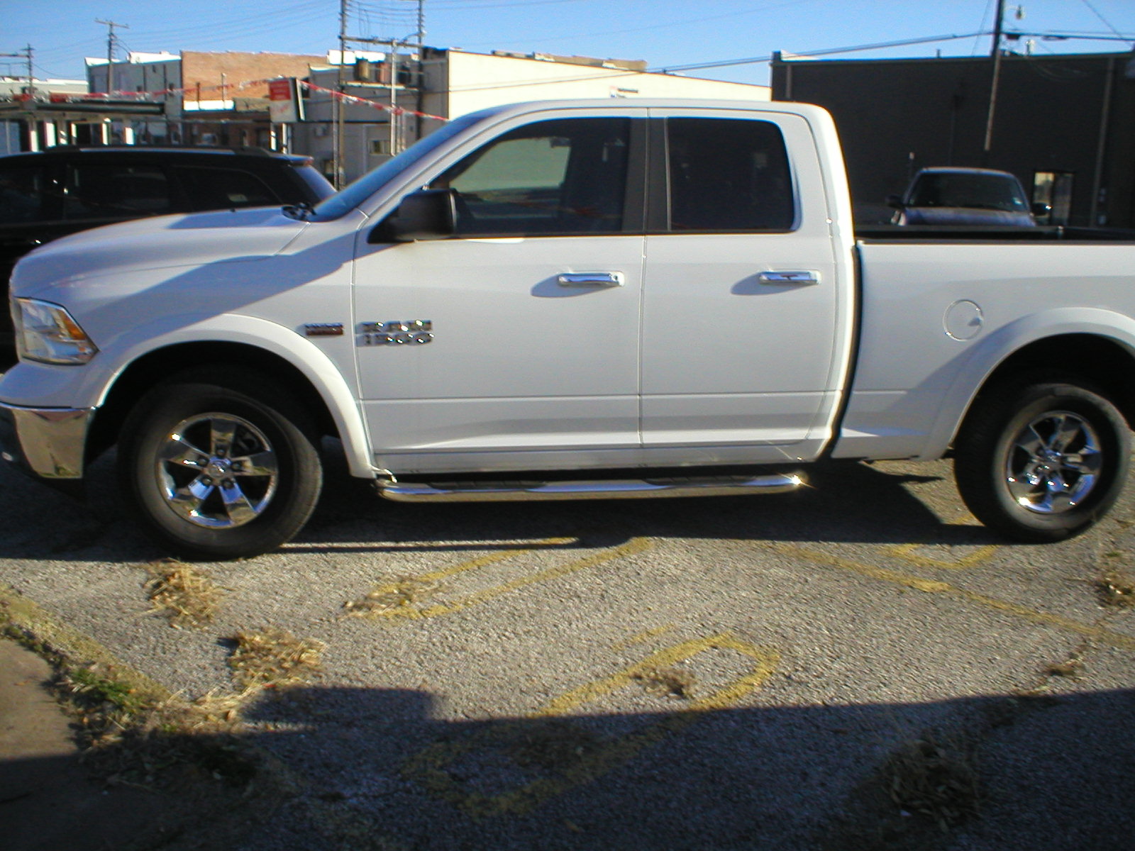 2016 Dodge Ram 1500 SLT Quad Cab 4-Door Pickup White - Fred Pilkilton Motors - Denison Texas