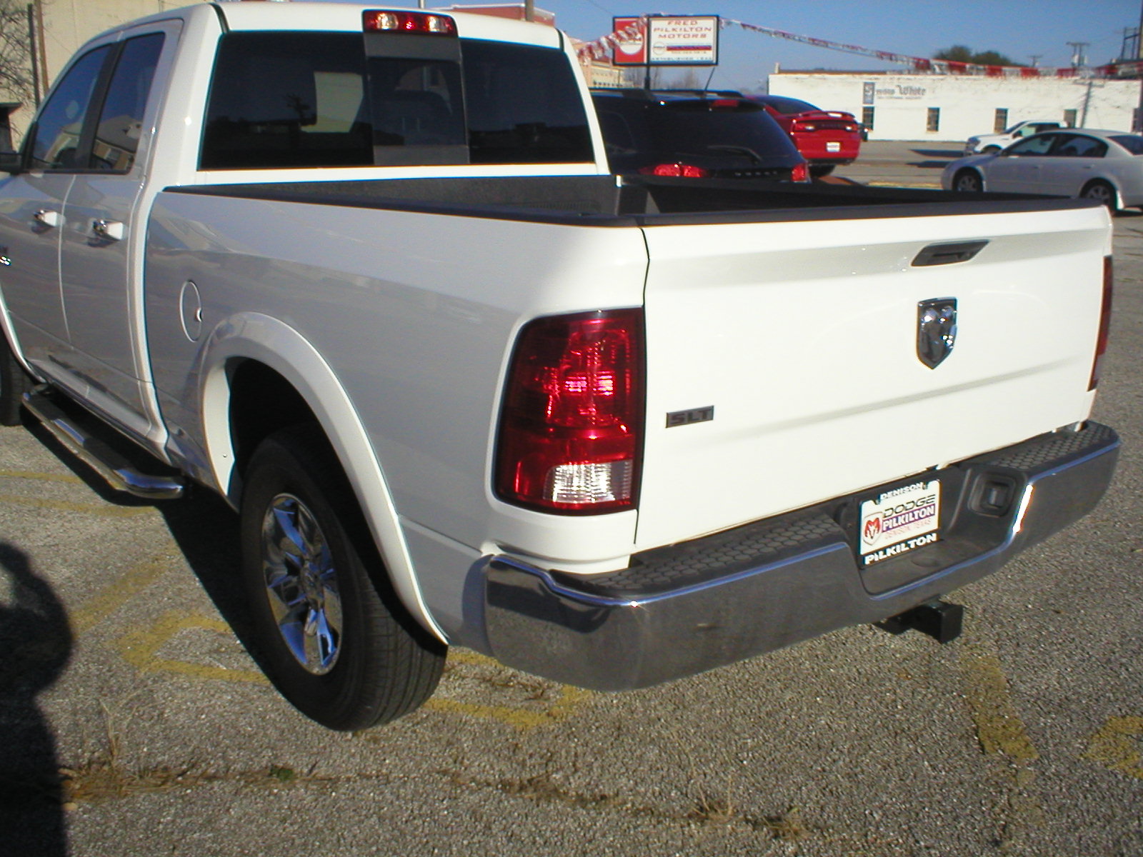 2016 Dodge Ram 1500 SLT Quad Cab 4-Door Pickup White - Fred Pilkilton Motors - Denison Texas